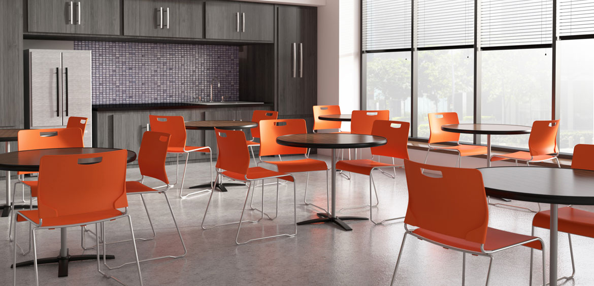 Cafe with orange chairs and round tables